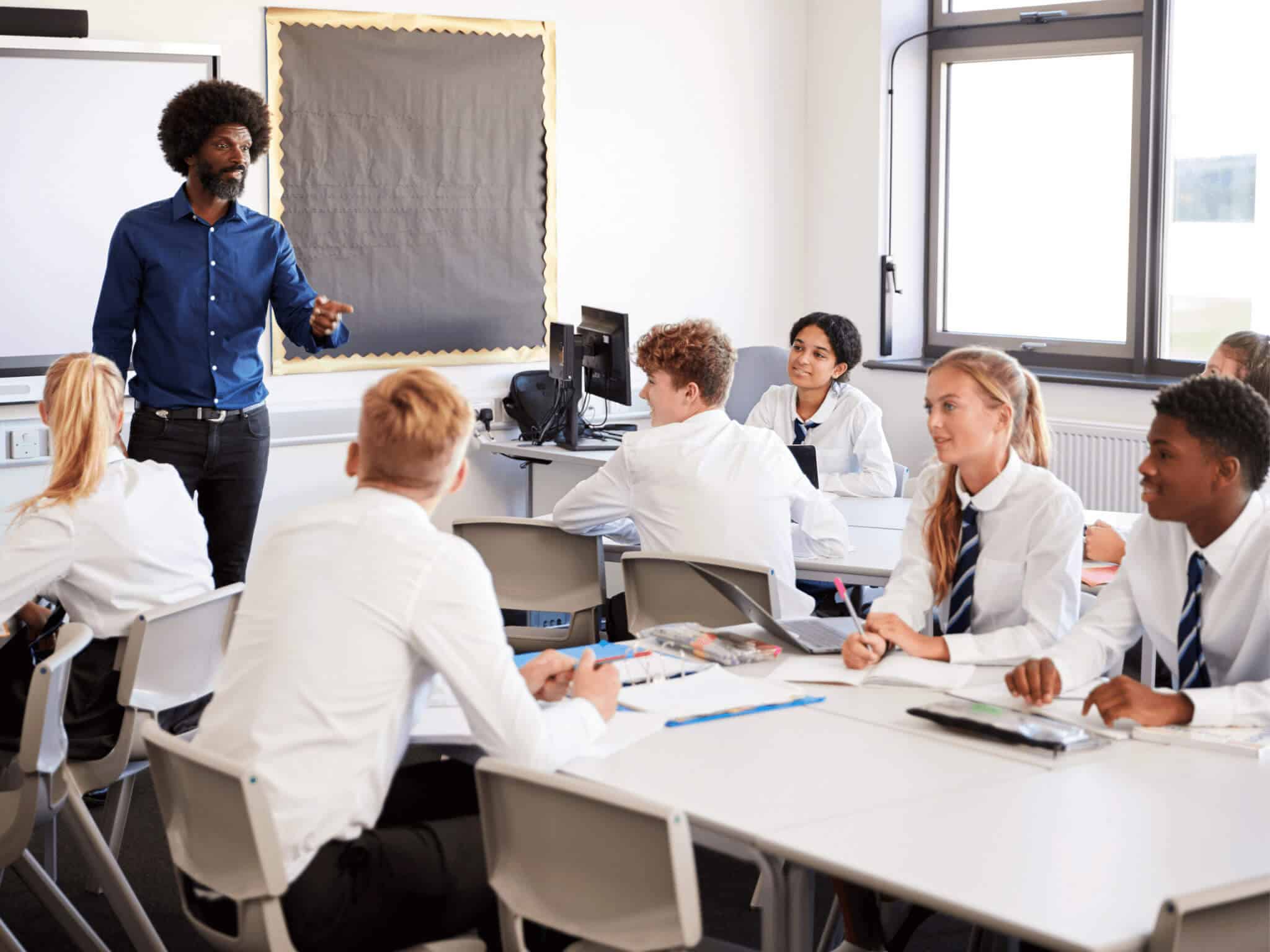 teacher pointing in classroom